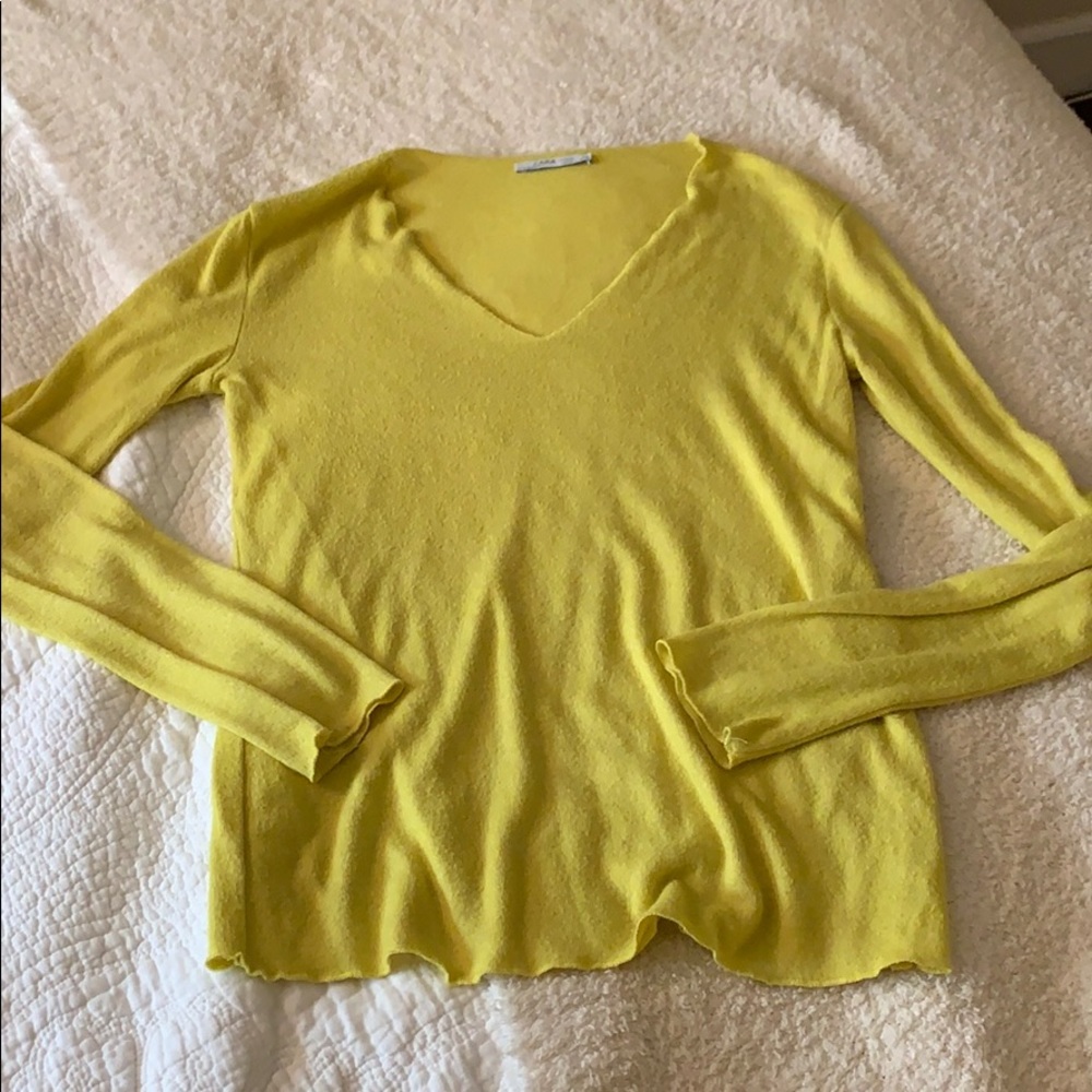 Bright yellow knit blouse